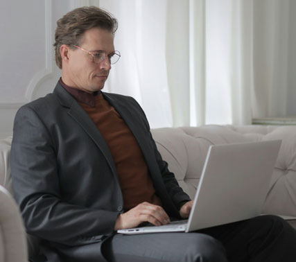 Focused student working on a laptop