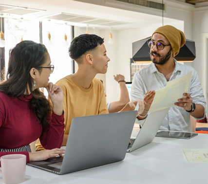 Focused student working on a laptop